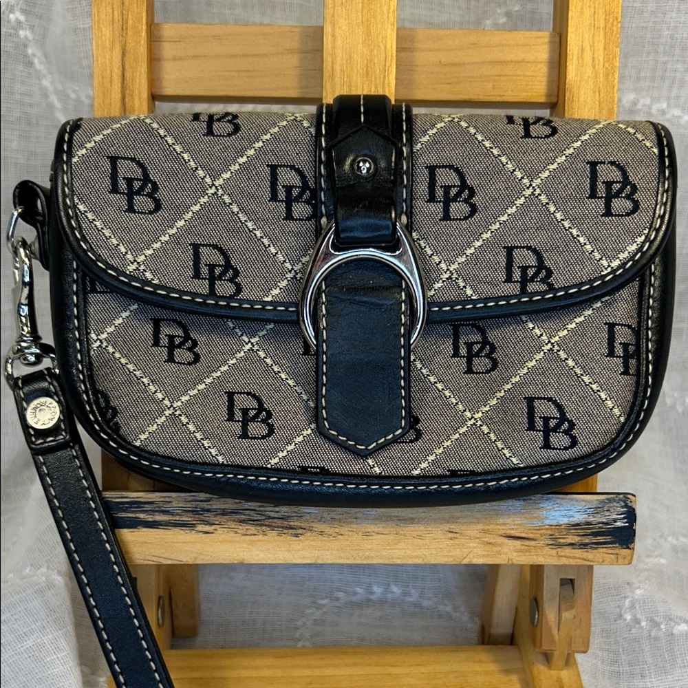 Dooney and Bourke almost new leather canvas wristlet